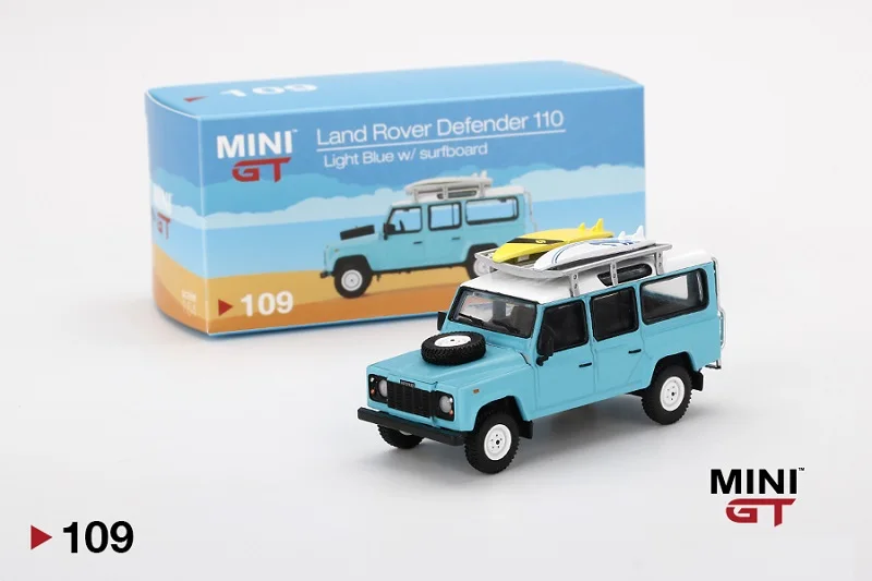 MINI GT 1:64 Land Rover Defender 110 Svetlo Modrá s Surf LHD Diecast Model Auta